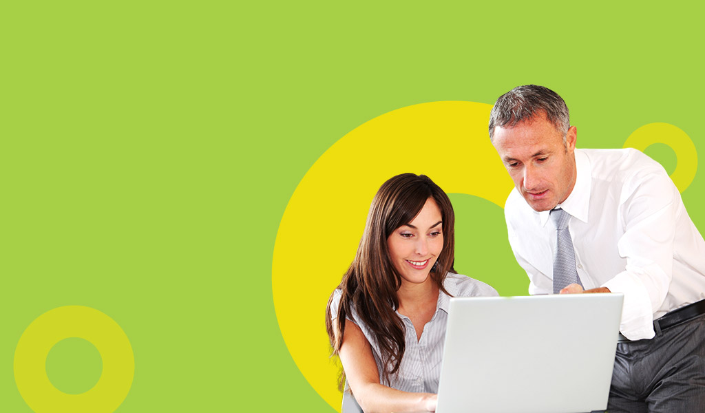 Banner featuring two people engaged in discussion, representing a collaborative learning consultancy environment. The individuals are reviewing documents or digital content, highlighting the personalized approach to creating impactful learning strategies and solutions.