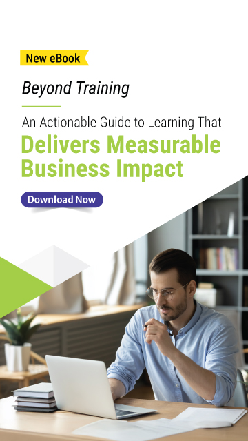 Man in glasses working on a laptop at a desk with documents and a plant, next to text promoting Upside Learning’s eBook “Beyond Training: An Actionable Guide to Learning That Delivers Measurable Business Impact,” with a Download Now button.